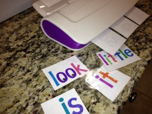 Laminating our flashcards for various word games.